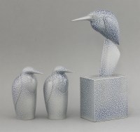 Lot 438 - A salt-glazed vase with bird head cover