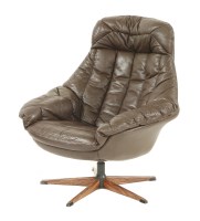 Lot 469 - A brown leather swivel armchair