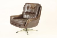 Lot 486 - A Danish brown leather swivel armchair