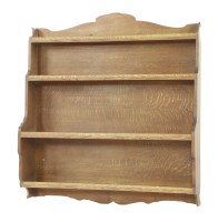 Lot 62 - An oak wall shelf