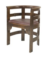 Lot 88 - An oak barrel back armchair