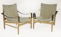 Lot 509 - A pair of teak and suede ‘Safari’ chairs