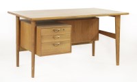 Lot 510 - A Danish teak desk