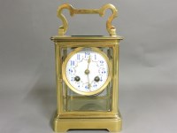 Lot 379 - A gilt brass four glass clock