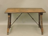 Lot 743 - A Spanish walnut trestle table
