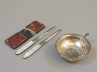 Lot 202 - A Georgian silver folding fruit knife and fork