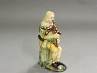 Lot 291 - An early 20th century Whieldon pottery style figure
