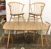 Lot 728 - An Ercol extending dining table