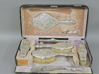 Lot 254 - A seven piece silver mounted dressing table set