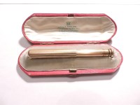 Lot 81 - A gold telescopic action propelling pencil