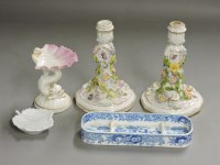 Lot 323 - A pair of Continental porcelain candlesticks