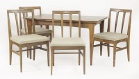 Lot 810 - A teak draw leaf dining table
