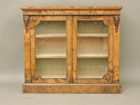 Lot 689 - A Victorian walnut veneered display cabinet
