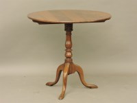 Lot 769 - A Georgian style oak tripod table