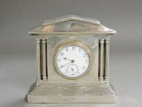 Lot 264 - A silver mounted miniature mantel clock