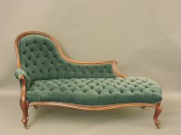 Lot 679 - A Victorian walnut button back settee