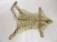 Lot 420 - A snow leopard skin rug