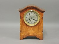 Lot 303 - An Edwardian inlaid mantel clock
