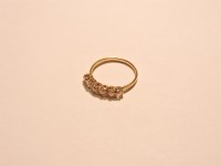 Lot 9 - A six stone graduated diamond half hoop ring