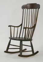 Lot 770 - A stick back rocking chair