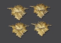 Lot 231 - Two pairs of matched silver gilt wine labels