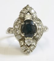 Lot 446 - A marquise shaped sapphire and diamond cluster ring