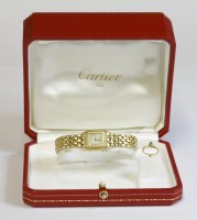 Lot 528 - A ladies' 18ct gold Cartier mini Panthere bracelet watch