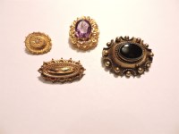 Lot 54 - A late Victorian gold Etruscan style oval brooch
