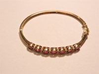 Lot 49 - A hinged gold bangle