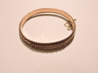 Lot 83 - A 9ct gold hinged bangle