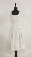 Lot 150 - A 1950s white taffeta and lace beaded dress