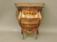 Lot 725 - An early 20th century Continental walnut bombe two drawer commode