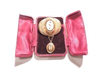 Lot 65 - A Victorian diamond and blue paste Etruscan style brooch