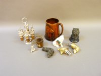 Lot 221 - A collection of sporting bottle stoppers on a stand