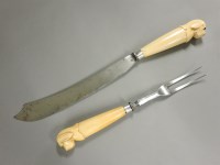 Lot 253 - A silver mounted ivory handled carving set