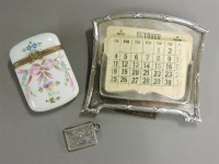 Lot 212 - A silver mounted desk calendar