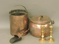 Lot 566 - A Georgian oval copper cooking pot with lid and iron handle