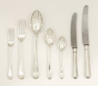 Lot 55 - A George III/IV silver old english feather edge pattern flatware service