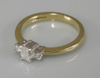 Lot 1011 - An 18ct gold single stone emerald cut diamond ring