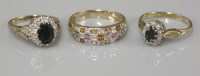 Lot 1043 - A 9ct gold sapphire and diamond oval cluster ring