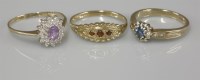 Lot 1034 - A 9ct gold amethyst and diamond oval cluster ring