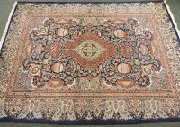 Lot 1815 - A large Persian carpet