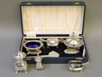Lot 1169 - Two silver cruet sets