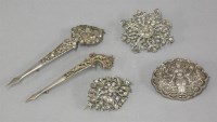 Lot 1078 - Two Sri Lankan kondakoora hair cups