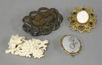 Lot 1082 - A carved ivory grapes and vine leaf brooch