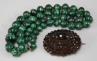 Lot 1054 - A Bohemian cabochon and rose cut garnet oval cluster brooch