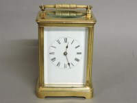 Lot 1202 - A brass carriage clock