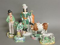 Lot 1398 - A Prattware pottery cow creamer