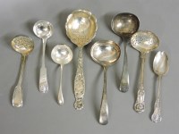 Lot 1163 - Four Victorian and later silver ladles and sifters