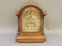 Lot 1373 - A Victorian oak cased striking mantle clock